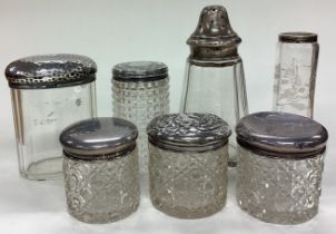 A large collection of silver mounted scent bottles.