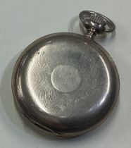 A heavy silver pocket watch.