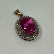 A small gem set pendant in 9 carat setting.