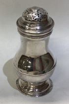 A Georgian silver caster.