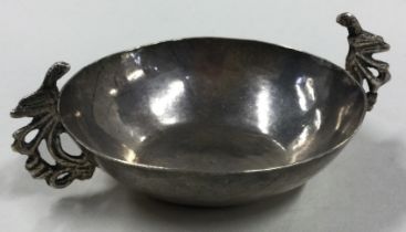 An early 19th Century South American silver two-handled dish.