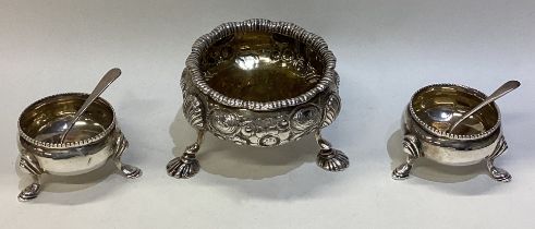 A small pair of silver salts together with one other.