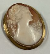 A good oval cameo of a lady's head in gold frame.