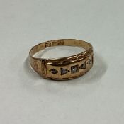 A small diamond five stone gypsy set ring in 18 carat gold mount.