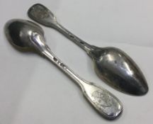 A fine pair of 18th Century French silver tablespoons with central armorials.
