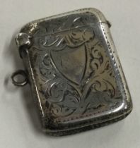 A silver vesta case with engraved decoration. Birmingham 1906.