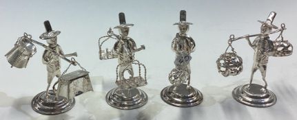A set of four Chinese silver figures of men with baskets