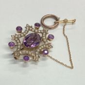 An attractive gold mounted amethyst and pearl brooch.