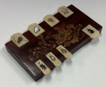 An unusual rosewood inlaid hinged top game.