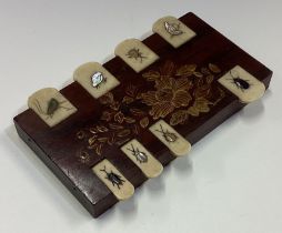 An unusual rosewood inlaid hinged top game.