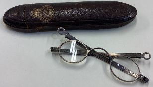 A pair of Victorian silver spectacles in Carpenter & West retail case.