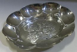 A fine chased silver dish decorated with cherubs. Birmingham 1899.