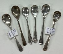 A small collection of silver OE pattern salt spoons.