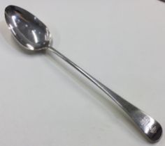 A large George III silver crested basting spoon.