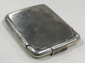A silver match holder with hinged lid. Birmingham.