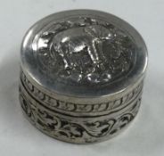 A chased silver counter box with lift-off lid.