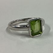 A heavy single stone ring in 9 carat setting.
