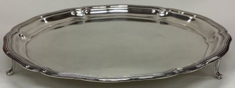 CHESTER: A circular silver salver with reeded rim.