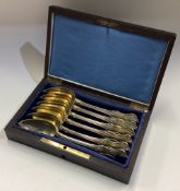 A set of six 19th Century French silver gilt spoons in original box.