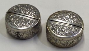 A pair of chased Continental silver menu holders.