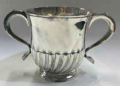 A rare George I silver fluted porringer. London 1726. By Timothy Ley.