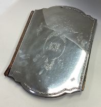 A large silver faced desk blotter with swag decoration.