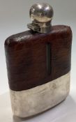 A large oversized Art Deco silver and leather flask. By James Dixon & Sons.