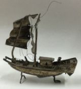 A 19th Century Chinese silver model of a junk.