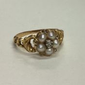 A Victorian 15 carat gold pearl cluster ring.