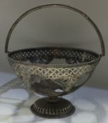 A Victorian silver swing handled basket.