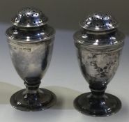 CHESTER: A pair of silver peppers. 1920.