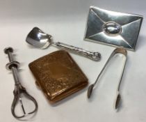 A pair of silver mounted sugar tongs together with a picture frame etc.