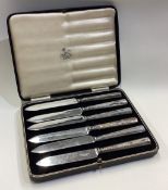 A cased set of six silver handled knives.