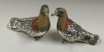 SATURNO: A rare pair of silver figures of birds.