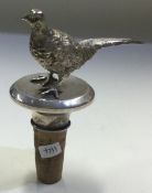 A heavy cast silver pheasant bottle stopper. London 1977.