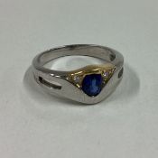 A sapphire and diamond three stone ring in 18 carat gold setting.