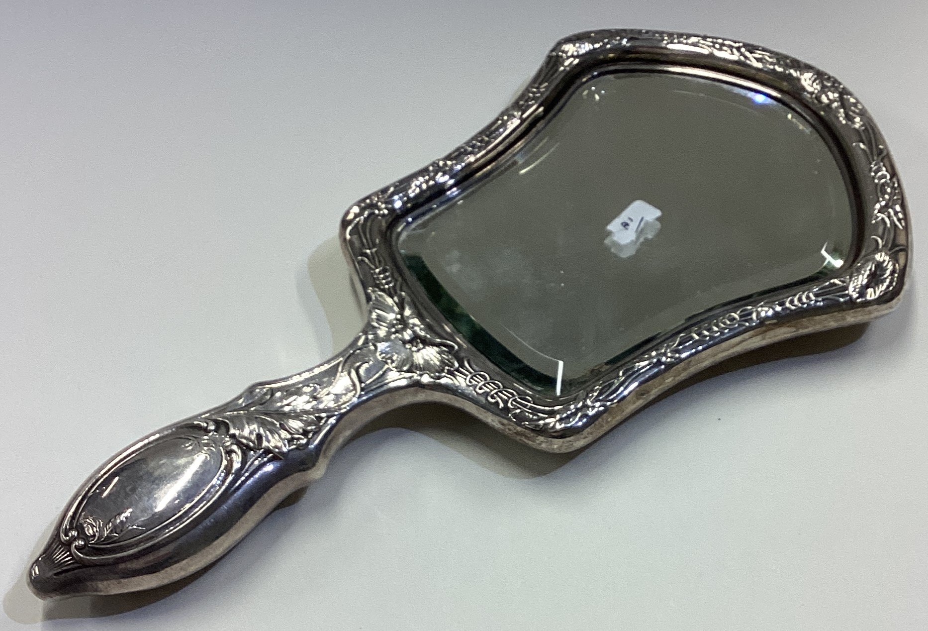 A fine and heavy Gorham silver mirror heavily chased with flowers. - Image 2 of 2