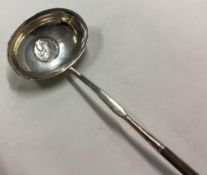 A Georgian silver toddy ladle with whalebone handle.