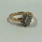 An oval diamond cluster ring in 18 carat gold claw mount.