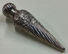 A chased Victorian silver scent bottle with screw top lid.