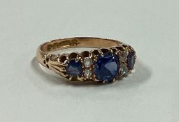 A good diamond and sapphire seven stone ring in 18 carat gold setting.