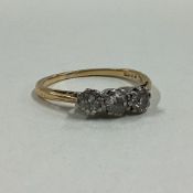 A good diamond three stone ring in 18 carat gold claw mount.