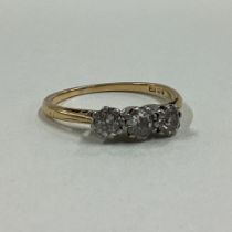 A good diamond three stone ring in 18 carat gold claw mount.