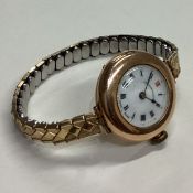 A lady's 9 carat wristwatch on expanding strap.