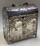 A 19th Century Dutch silver marriage casket chased with figures bearing import marks.