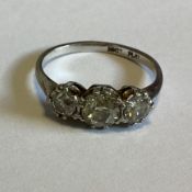 A good diamond three stone ring set in platinum claw mount.