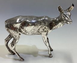 A large contemporary silver figure of a deer.
