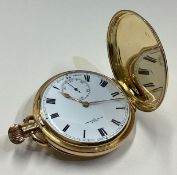 A gent's 18 carat gold Full Hunter pocket watch with white enamelled dial.