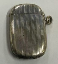 A silver plated vesta case with engine turned decoration.