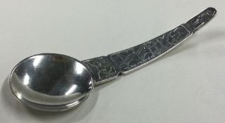 An Arts and Crafts Continental silver caddy spoon.